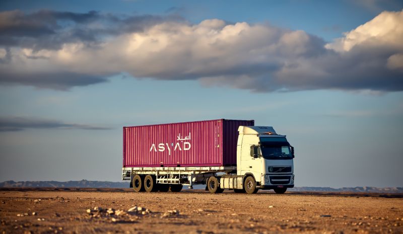 A truck with a container on the sideDescription automatically generated